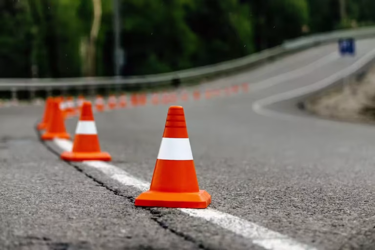 Bright orange traffic cones on road
