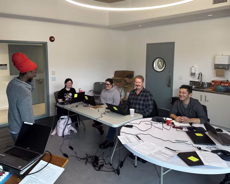 people training on computers in office