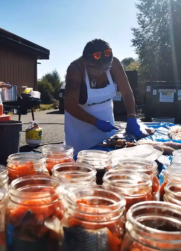 salmon being processed in jars